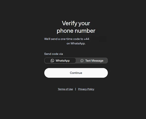 OpenAI 的 Verify your phone number 页面，可以选择通过 WhatsApp 或短信（Text Message）接收一次性验证码